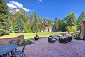 View of patio / terrace with expansive new landscaping.  Private and secluded with full fencing.