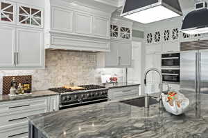 Stunning countertops, top of the line appliances, beautiful cabinetry.