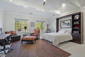 Large bedroom featuring crown molding, a ceiling fan, and carpet floors