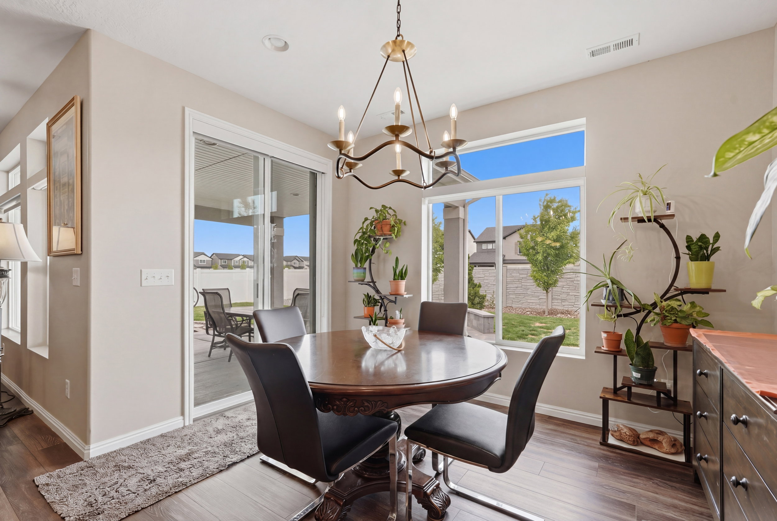 Dining area featuring hanging lights and dark wood-type flooring