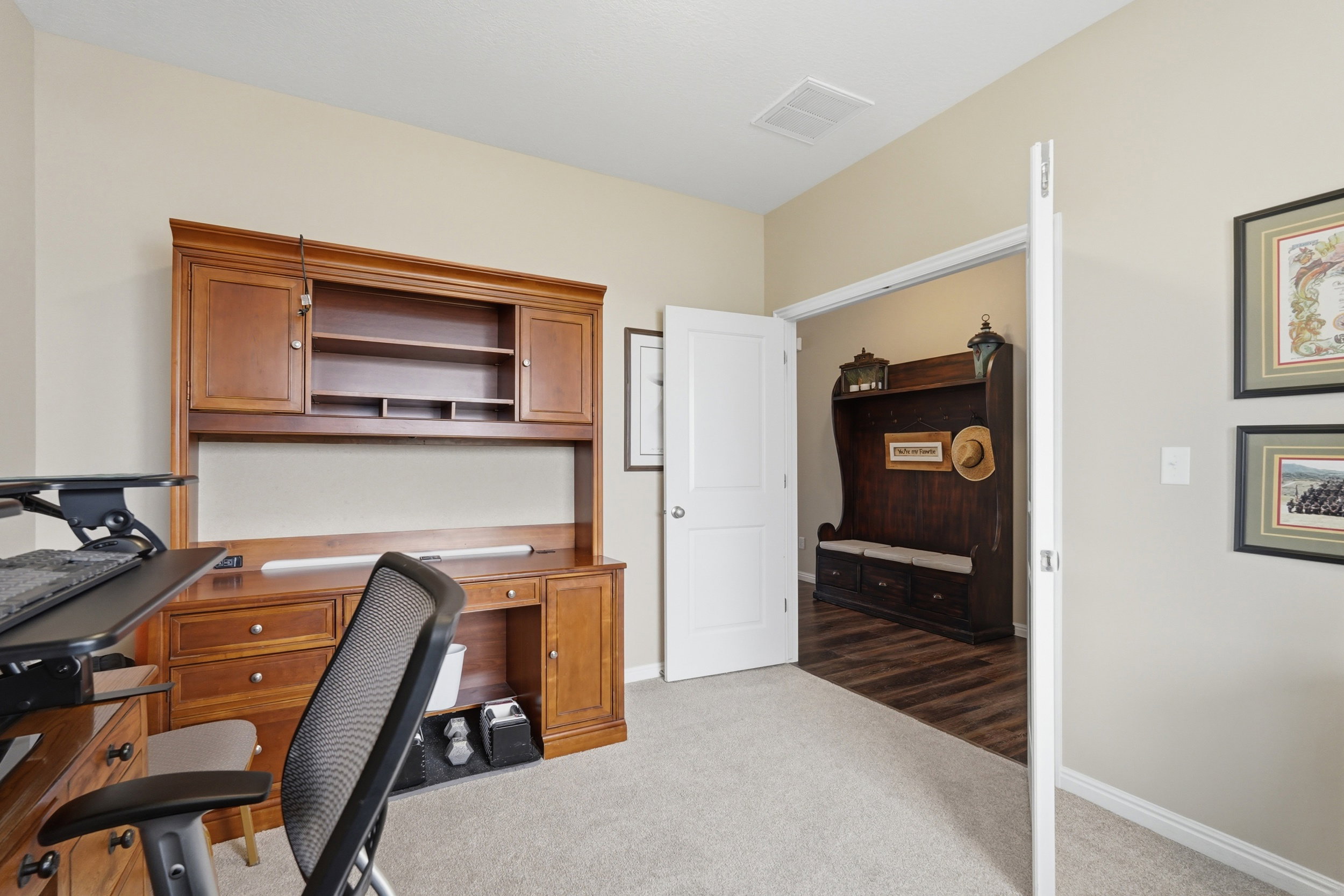 Office with light carpet and baseboards