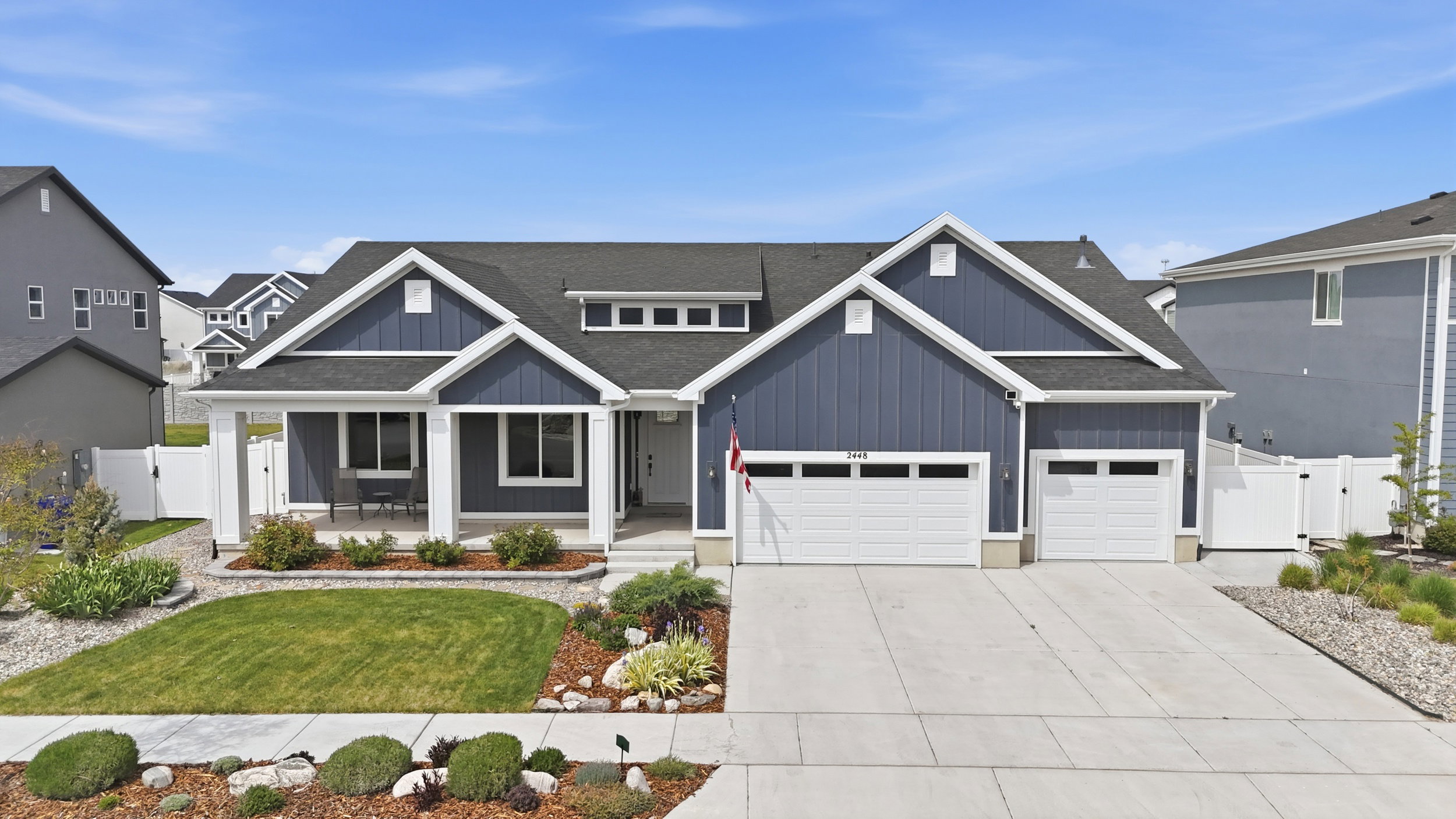 Craftsman inspired home with a gate, a porch, a shingled roof, and concrete driveway