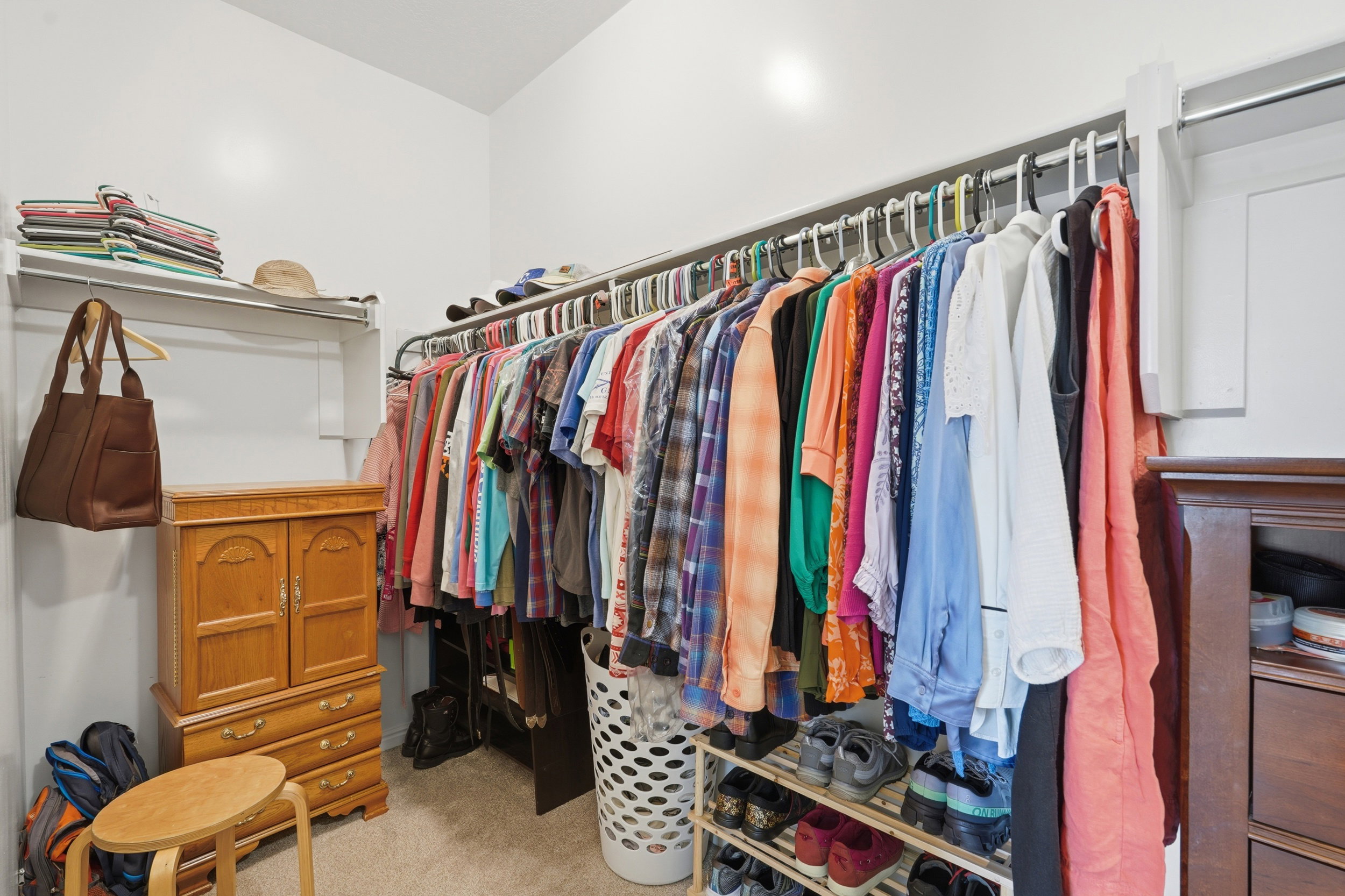 Walk in closet featuring light carpet