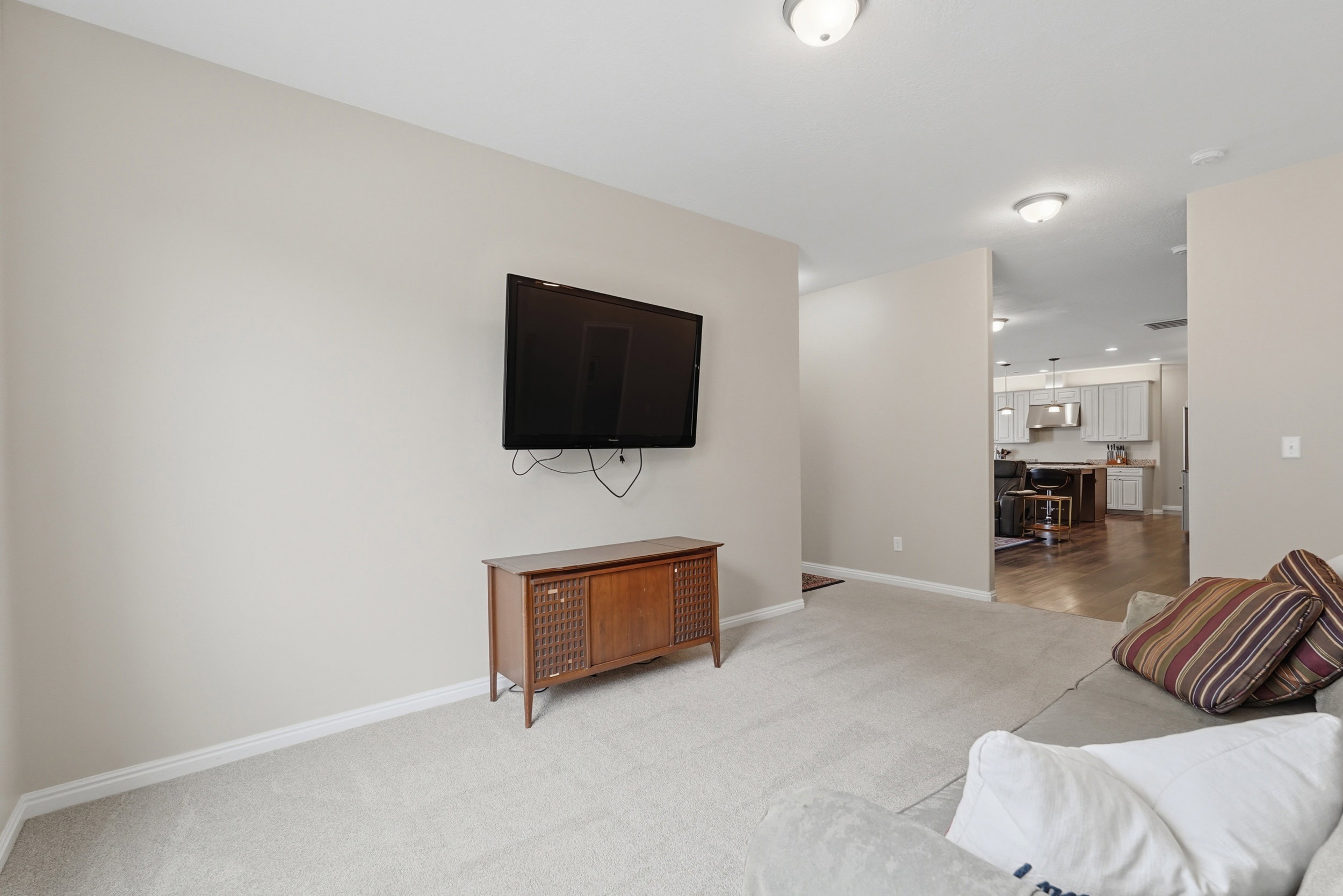 Living room with light carpet and baseboards