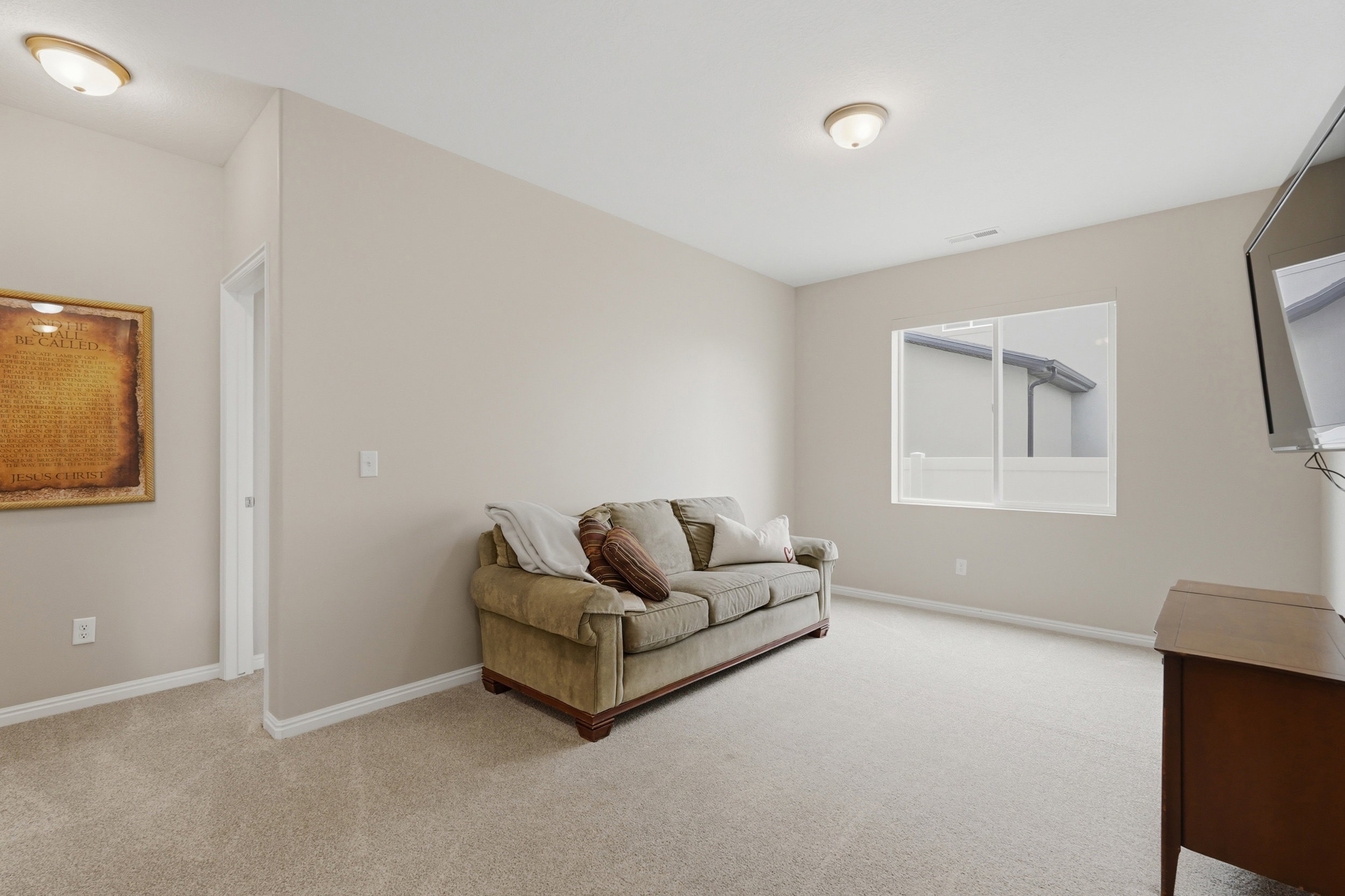 Living area featuring light carpet