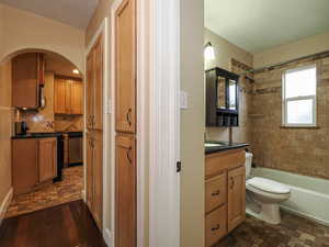 Bathroom featuring vanity and shower / washtub combination