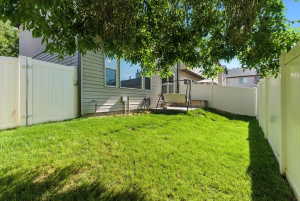 Fenced backyard with a gate