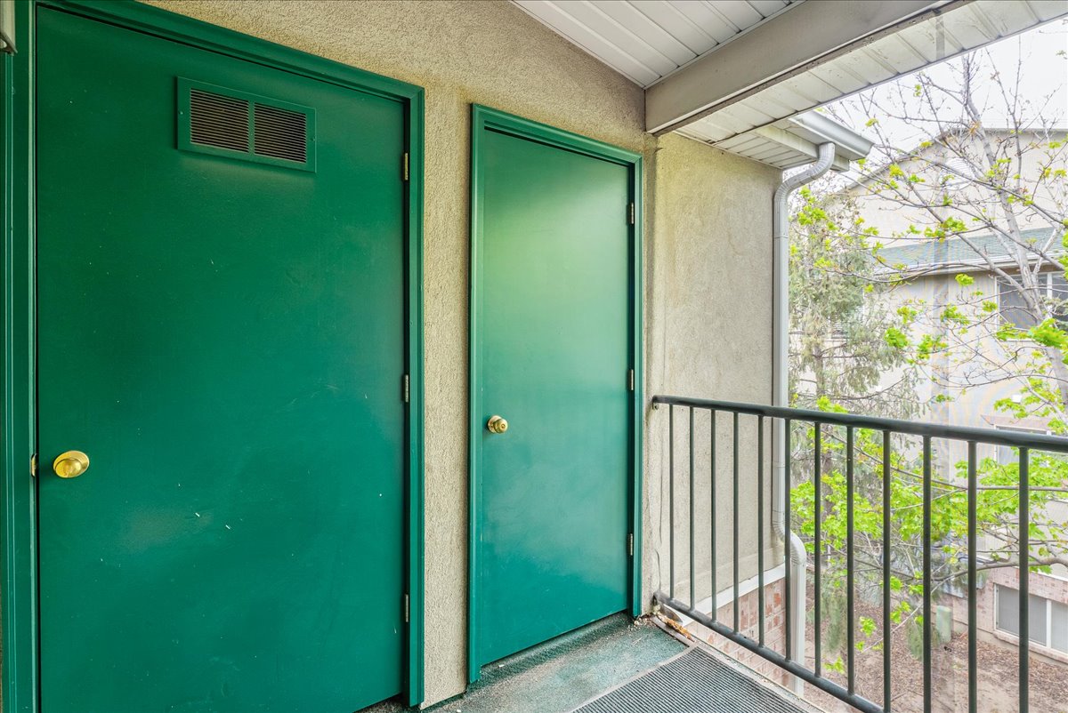 Entrance to property featuring stucco siding