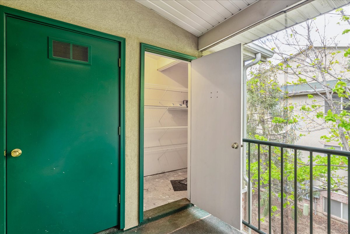 Doorway to property with stucco siding