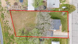 Aerial overhead of property's location featuring property boundaries highlighted