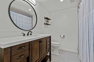 Full bath with vanity, a shower, recessed lighting, and tile patterned floors