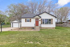 Front of home, a garage, and a concrete driveway
