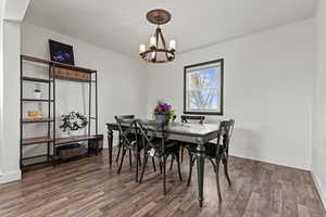 Dining room featuring a window and a hanging light
