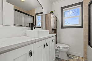Bathroom with vanity and tile patterned floors