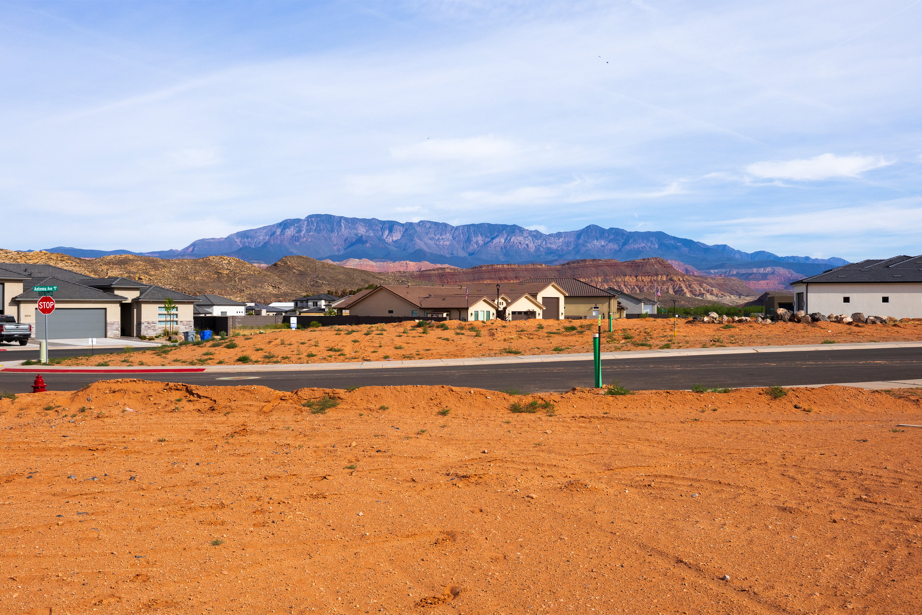 View of mountain backdrop featuring nearby suburban area