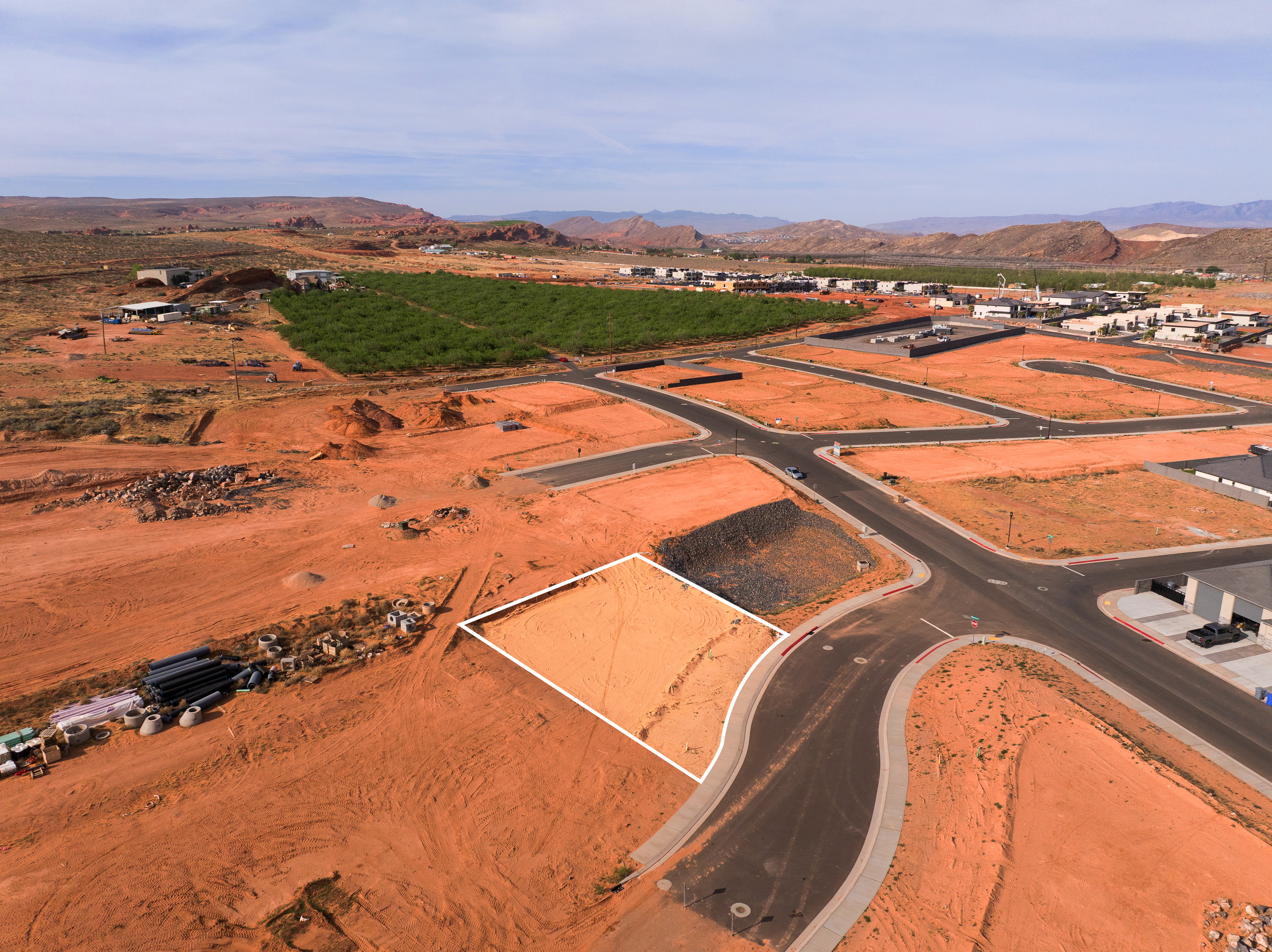 Aerial view of property and surrounding area with a mountainous background and rural landscape