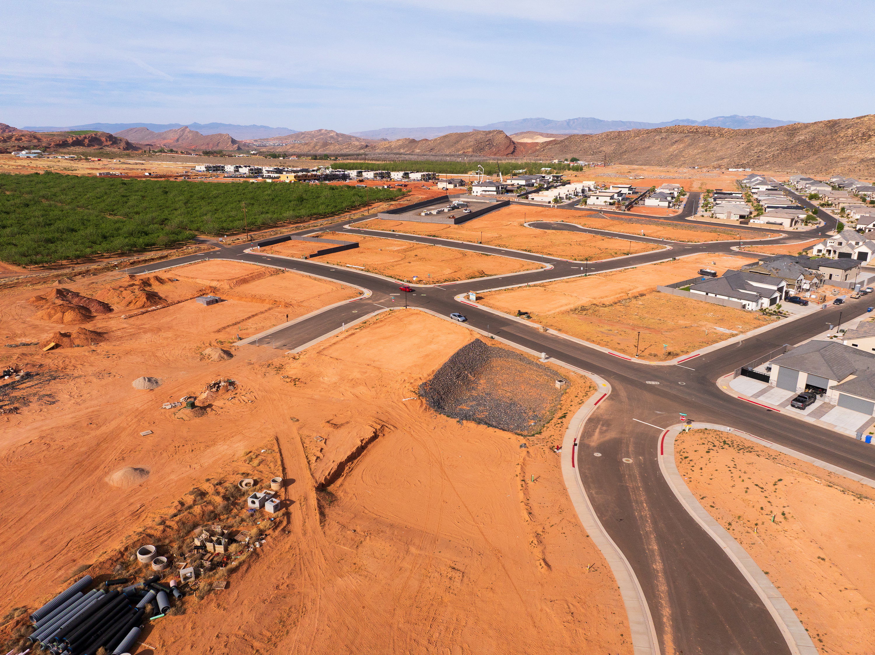 Aerial overview of property's location featuring mountains and nearby suburban area