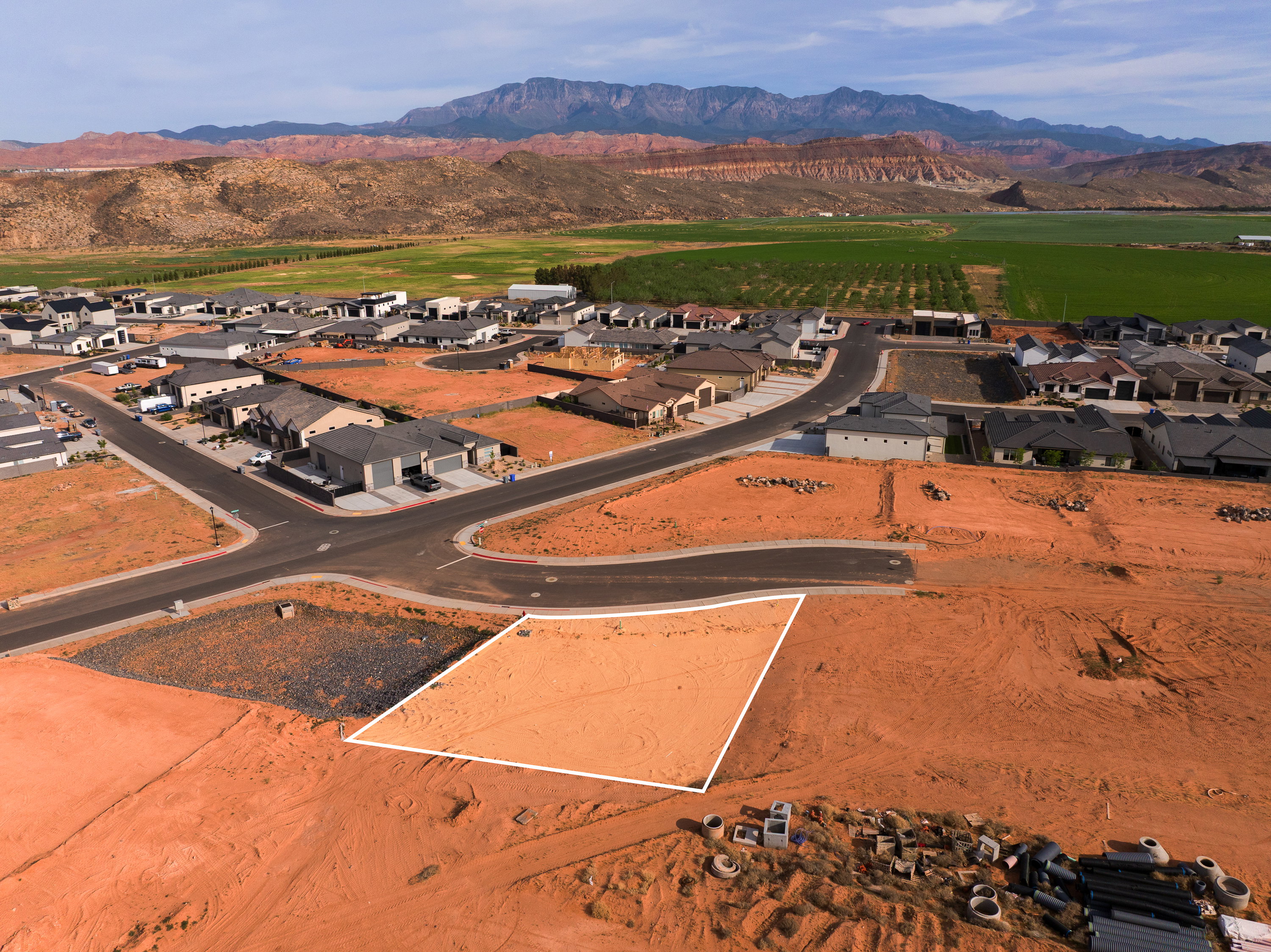 View of property location featuring mountains and nearby suburban area