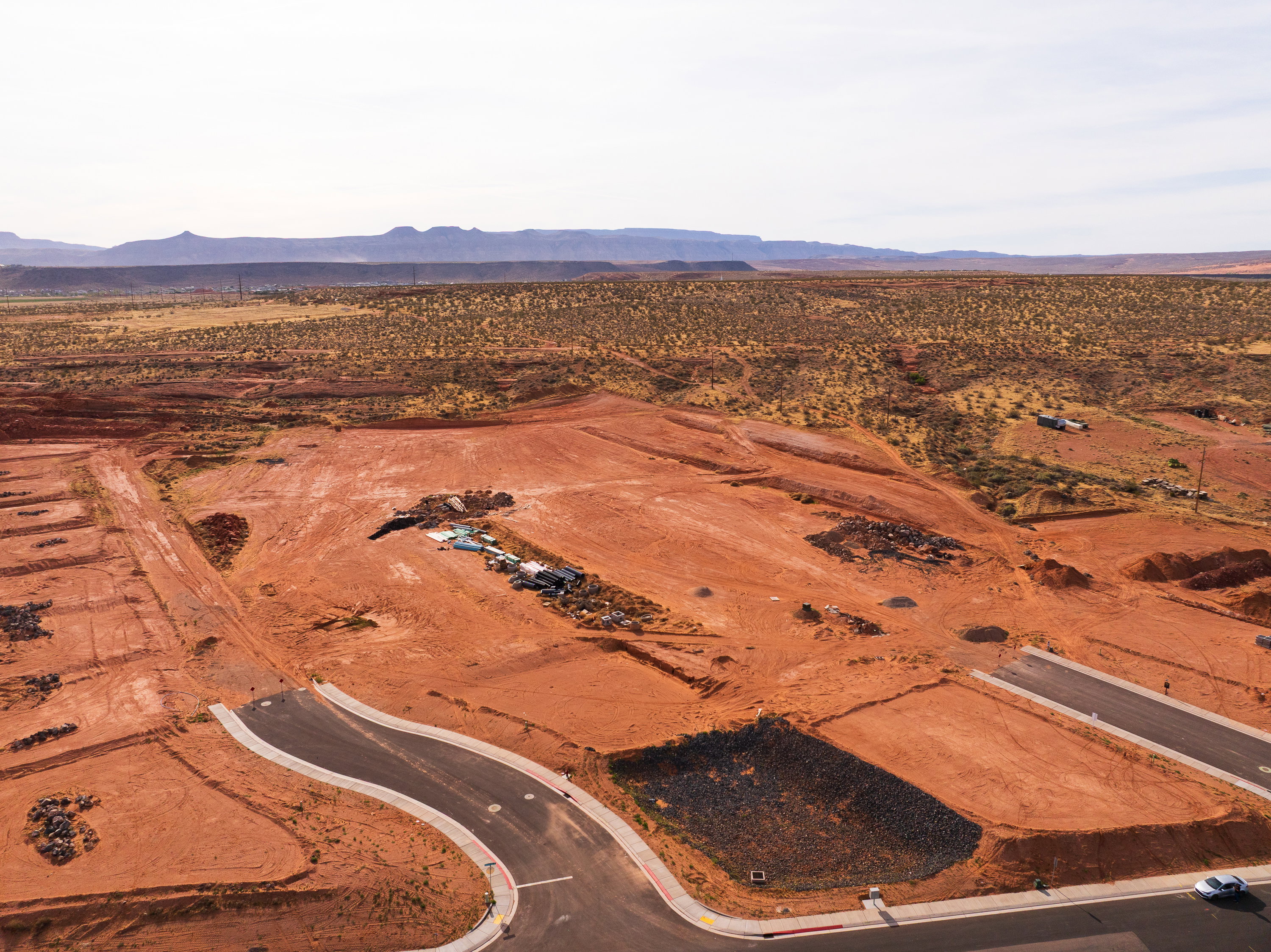 View of rural area with a desert landscape and a mountain backdrop