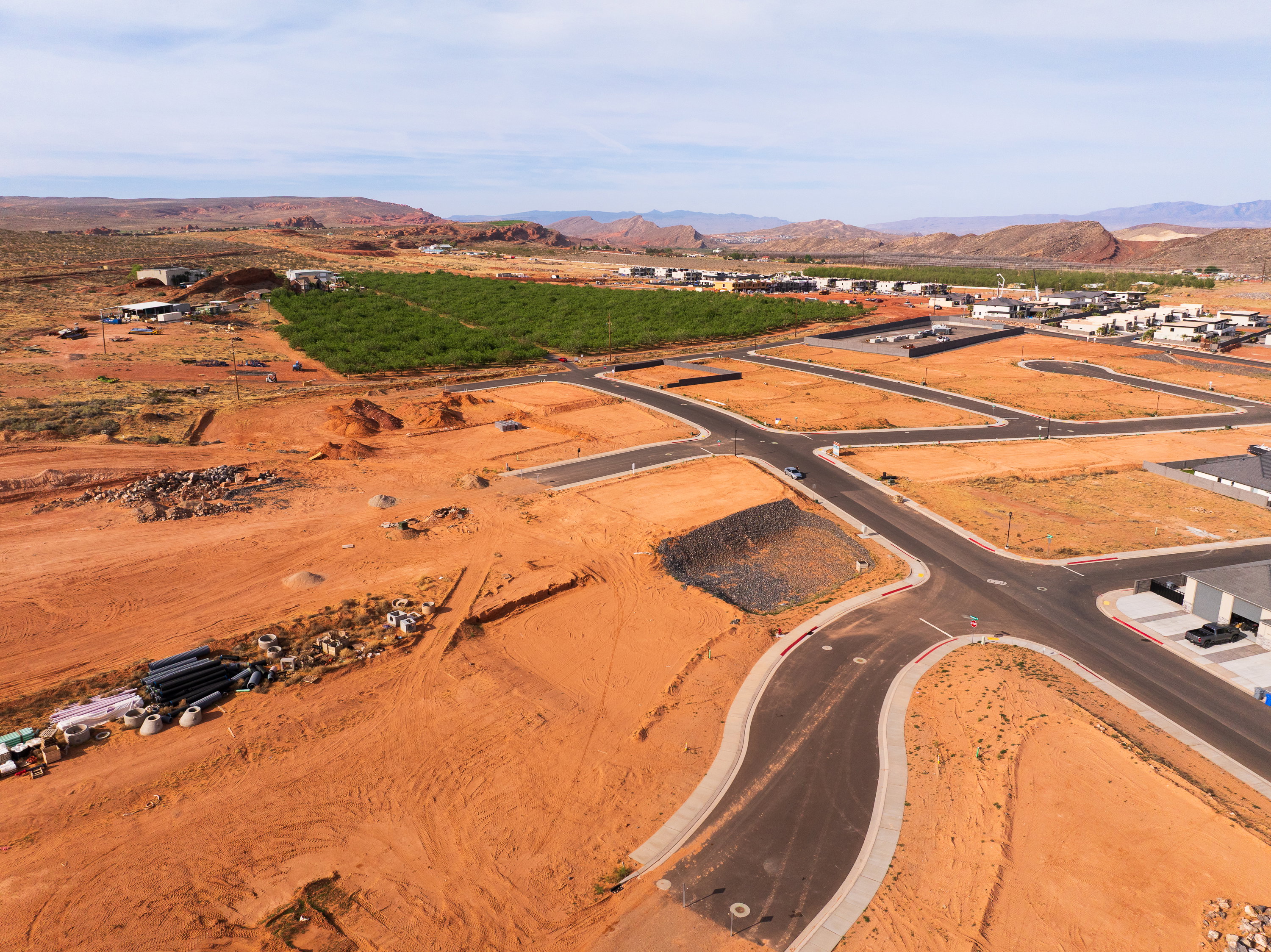 Aerial overview of property's location with a mountainous background and rural landscape