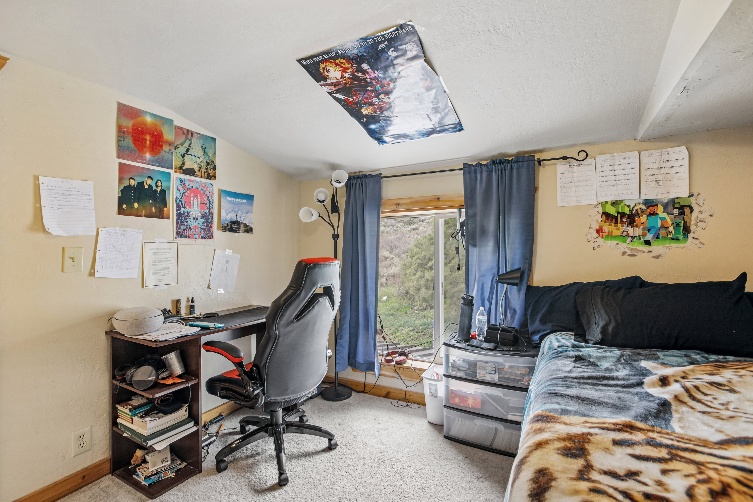 Office area with light colored carpet and vaulted ceiling