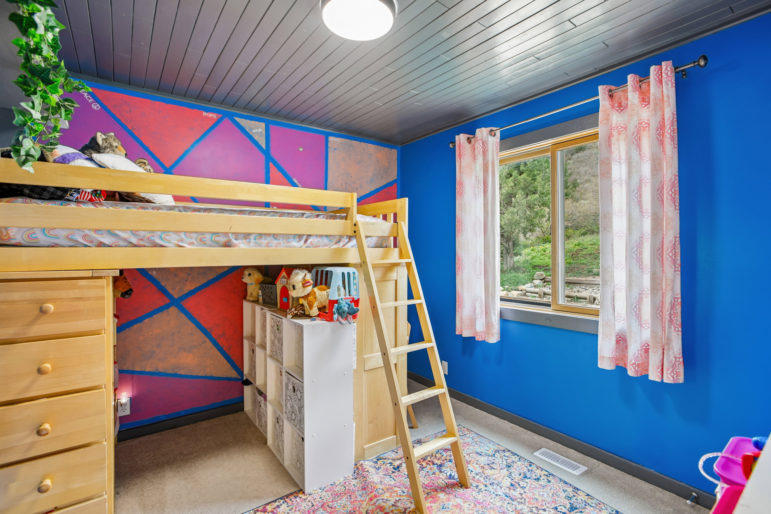 Bedroom with wood ceiling and light carpet