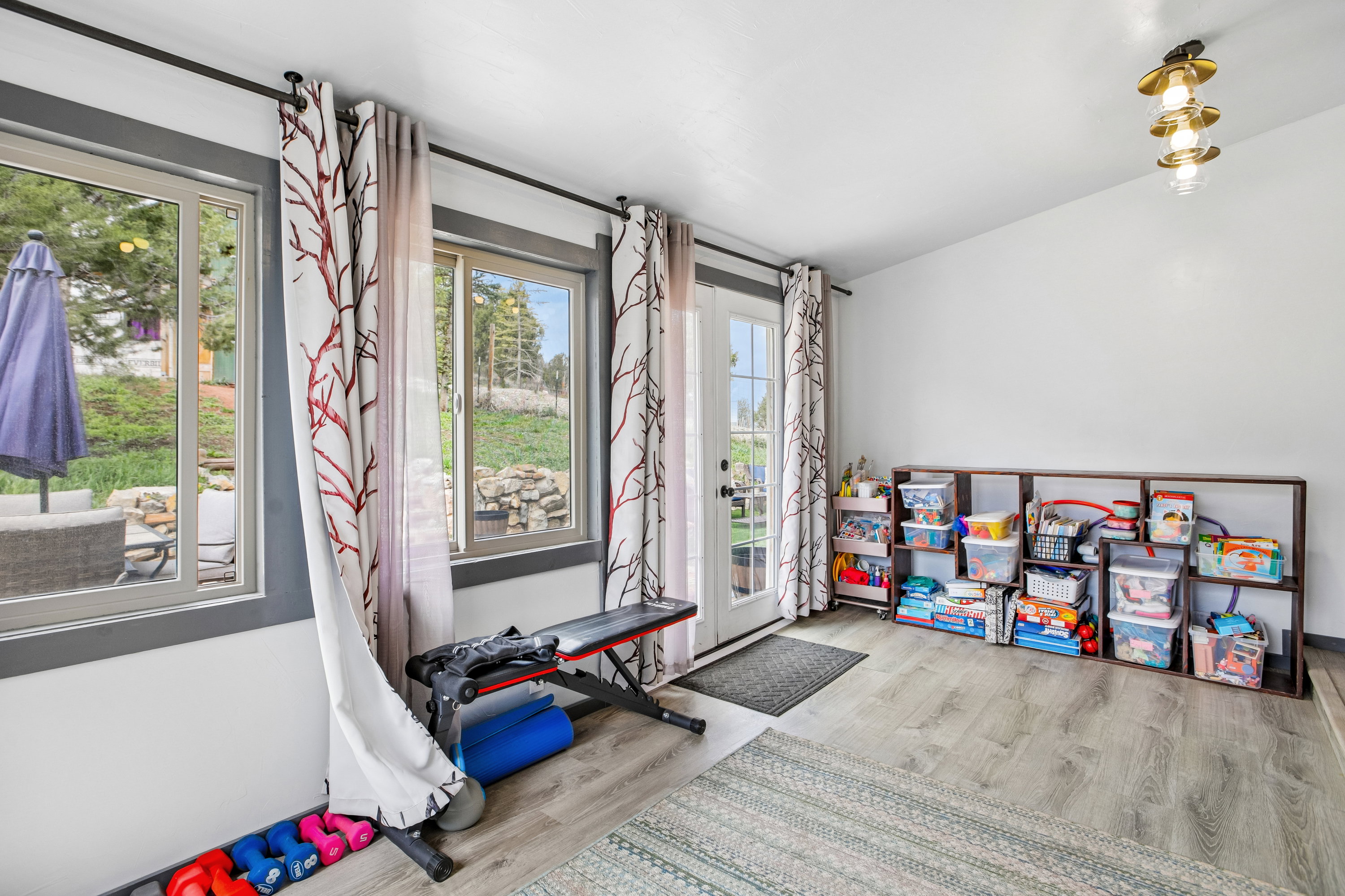 Playroom with light wood-style flooring and plenty of natural light