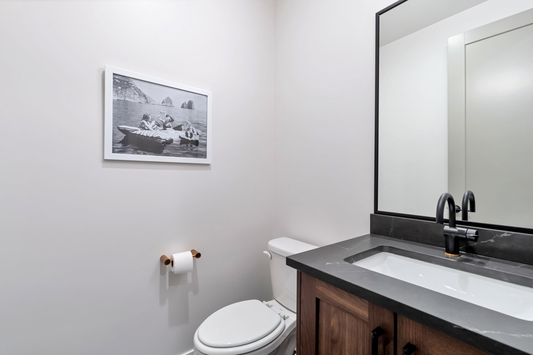 Half bathroom with vanity and toilet