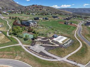 Aerial overview of property's location with a mountainous background