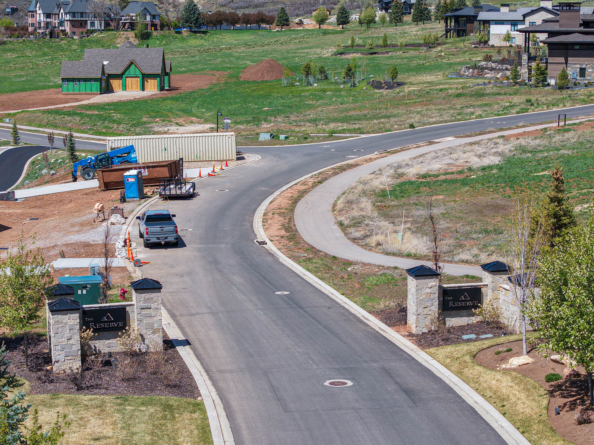 View of asphalt road featuring a residential view