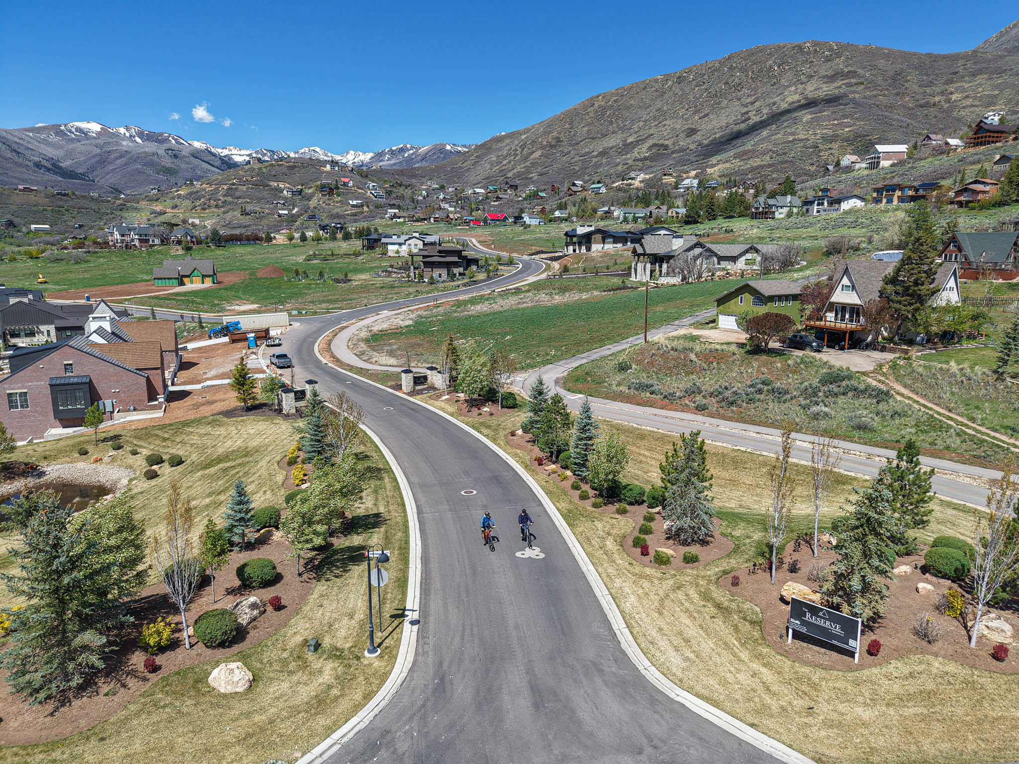 Aerial overview of property's location with a mountainous background