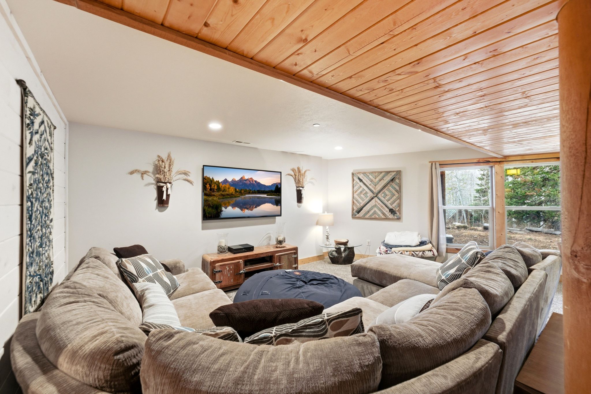Living area with wood ceiling, recessed lighting, and wood finished floors