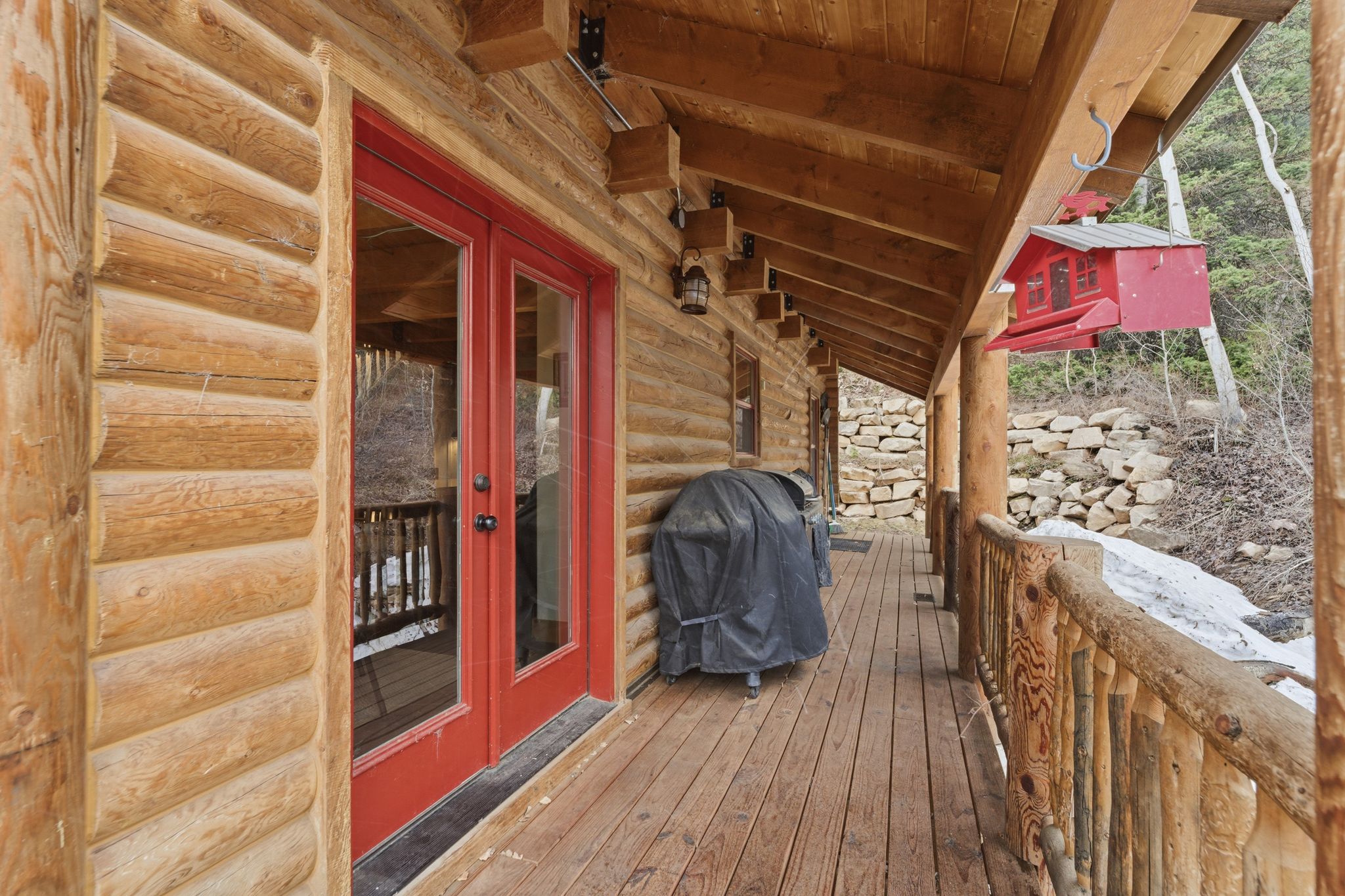 Wooden deck featuring french doors and grilling area