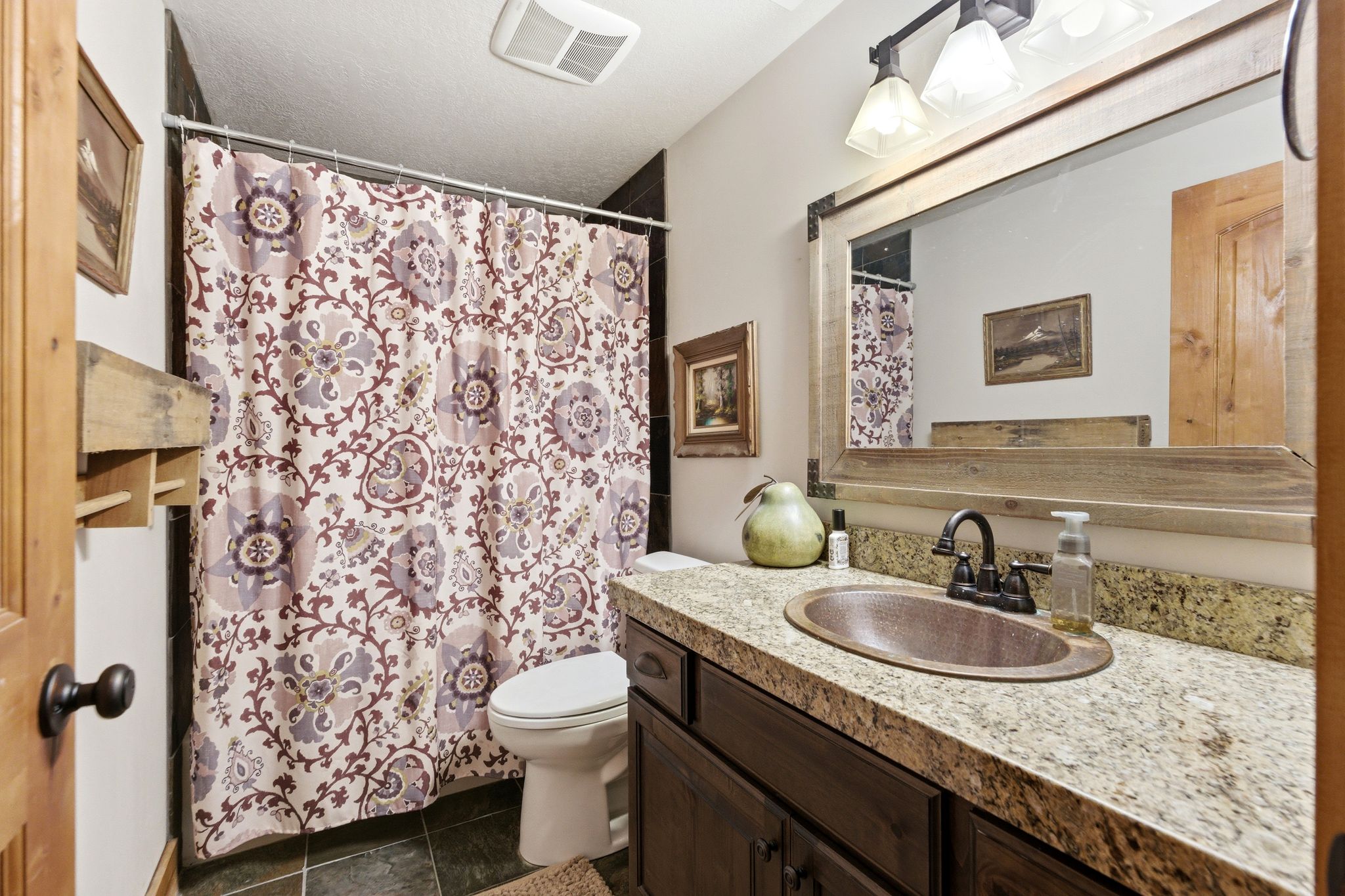 Full bath featuring vanity, a shower with curtain, and a textured ceiling