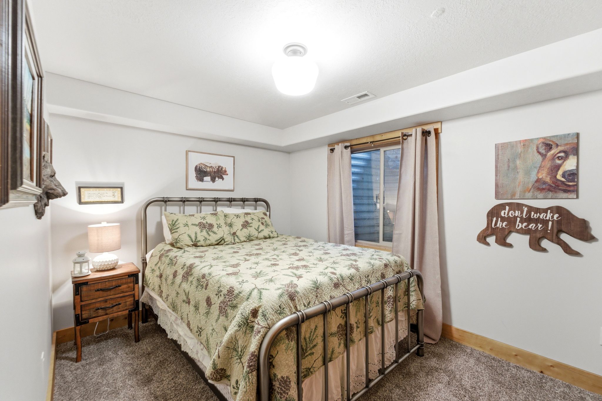Carpeted bedroom with baseboards