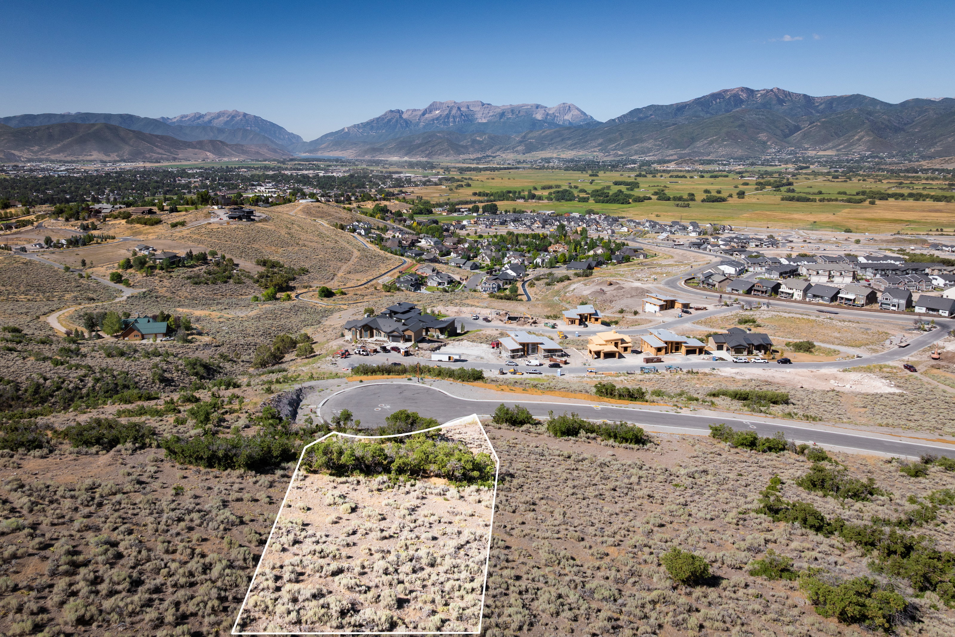 View of mountain backdrop featuring nearby suburban area