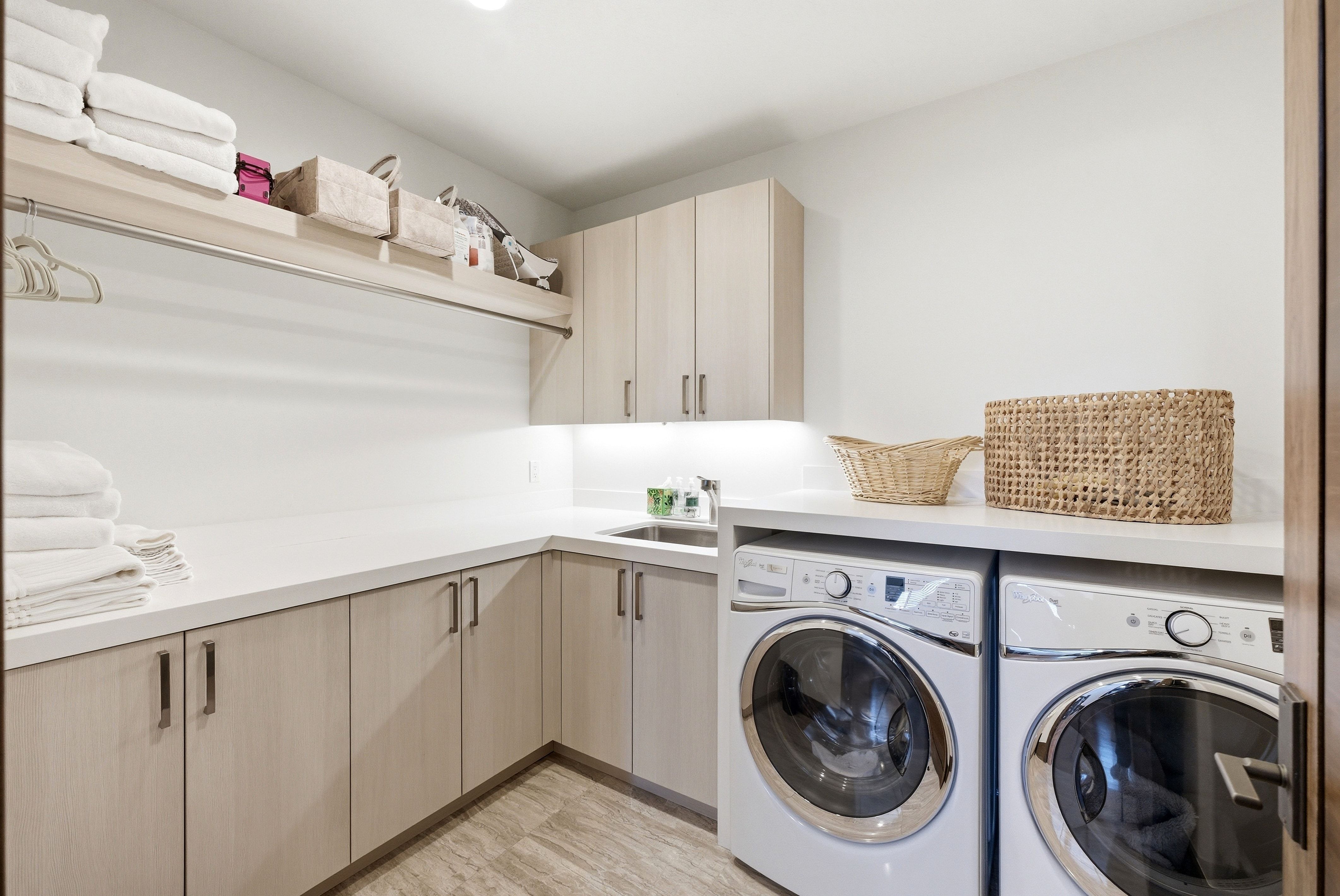 Laundry room with cabinet space and independent washer and dryer