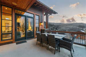Patio terrace at dusk with outdoor dining area