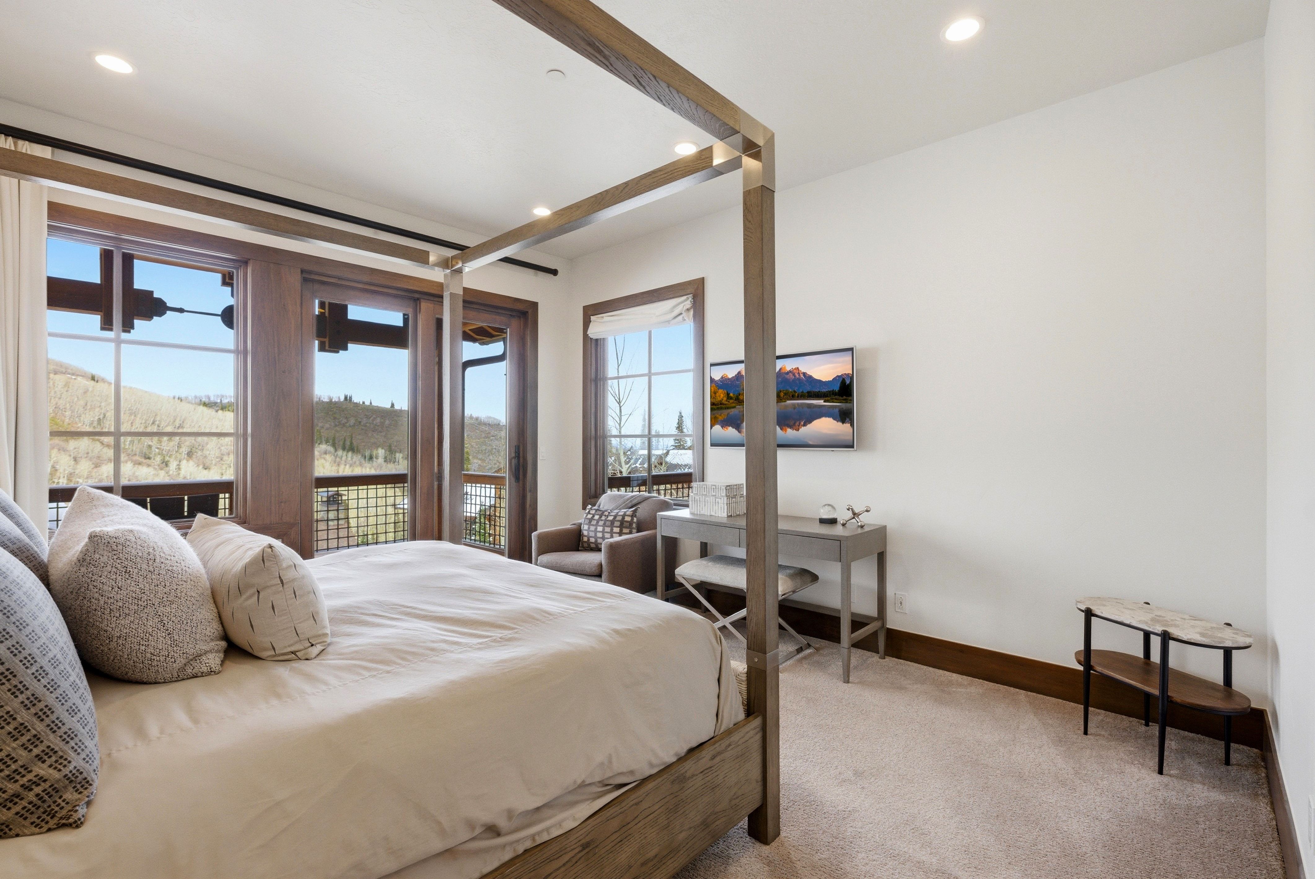 Bedroom with access to outside, light carpet, and recessed lighting