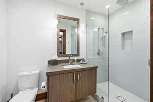 Full bath featuring vanity and a walk in shower