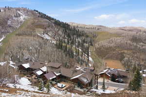 Snowy aerial view with a residential view and a mountain view