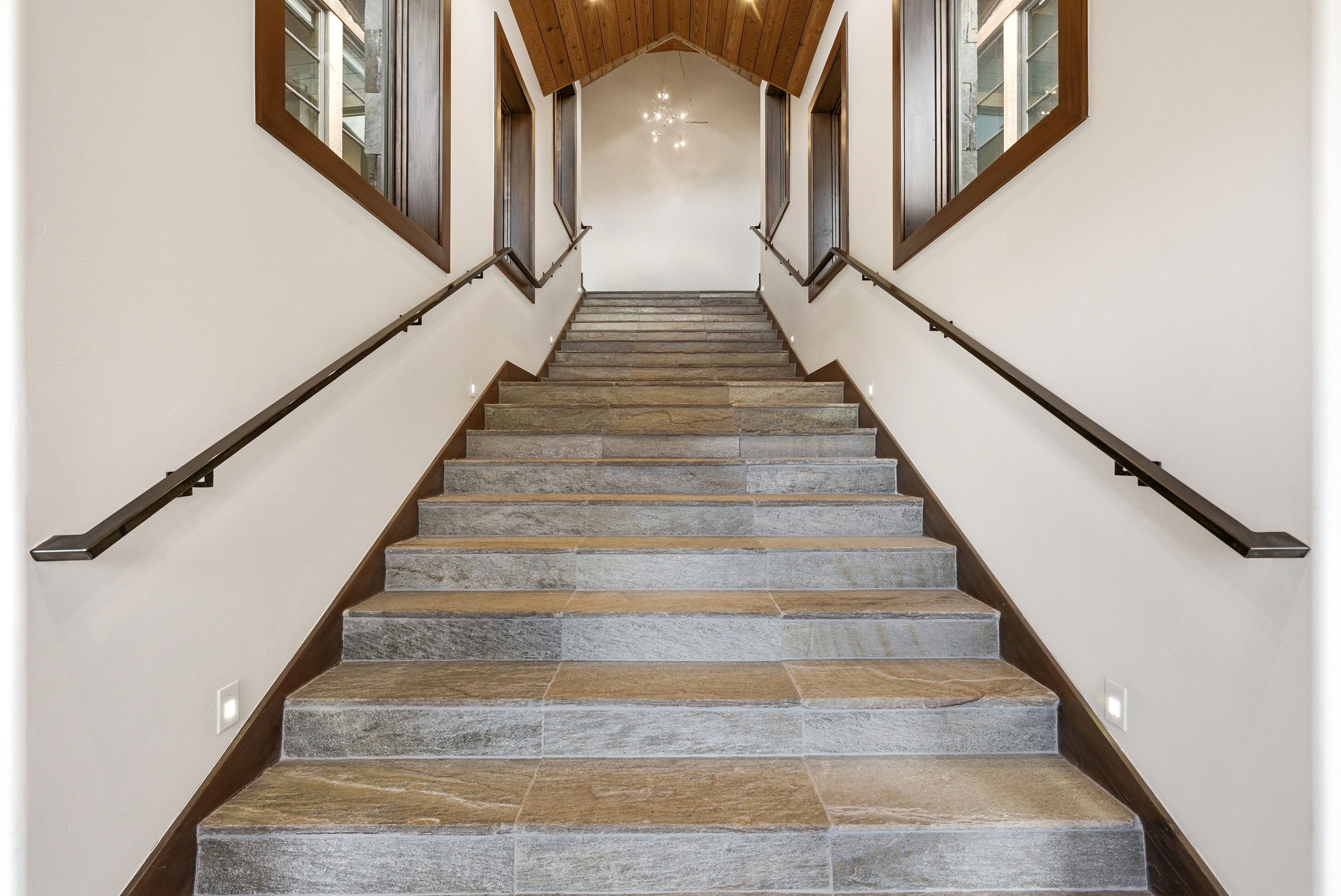 Stairs featuring wood ceiling