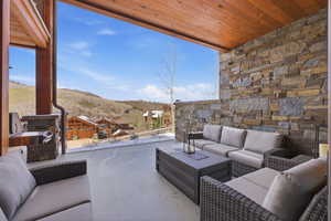 View of patio / terrace featuring outdoor lounge area and a mountain view