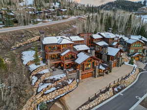 Snowy aerial view featuring a residential view