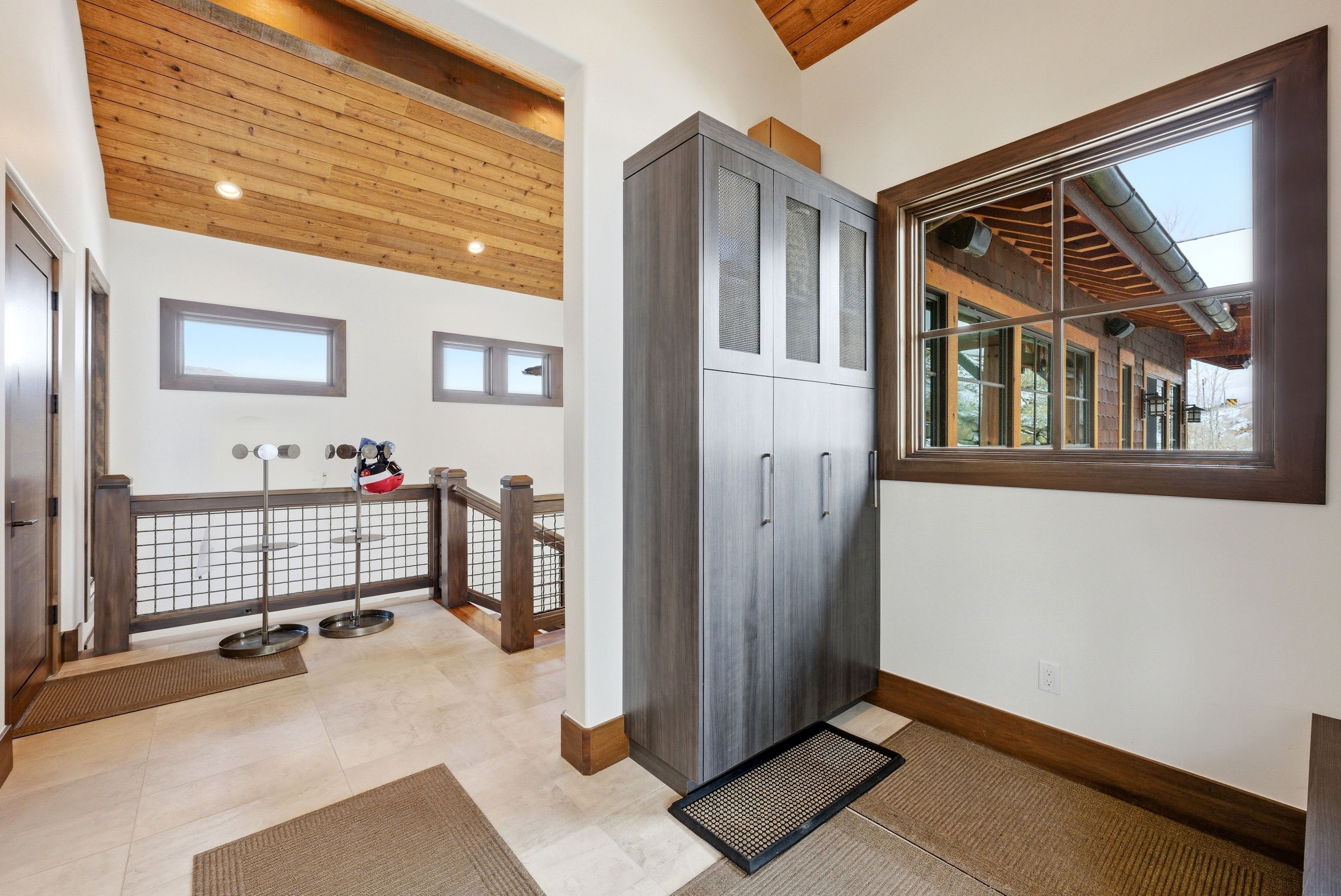 Foyer featuring wood ceiling and baseboards