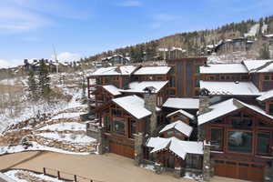 Snowy aerial view featuring a residential view