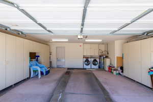 Garage with washer and dryer and water heater
