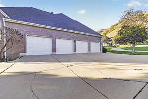 Garage featuring concrete driveway