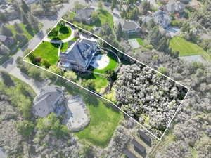 Aerial perspective of suburban area featuring property parcel outlined