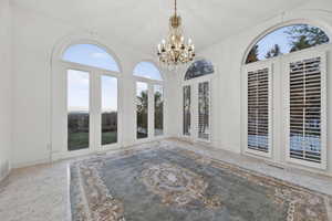 Solarium with french doors and chandelier